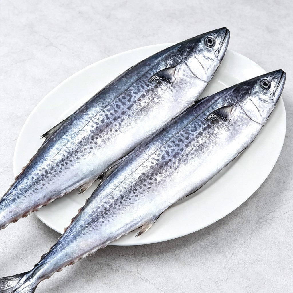 Sliced mackerel being lifted with chopsticks